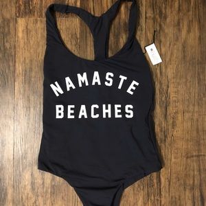 Spiritual Gangster one piece “Namaste Beaches”